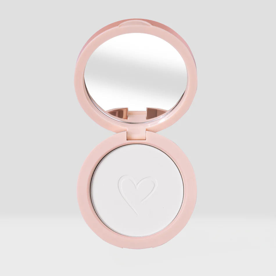 Poudre fixatrice compact